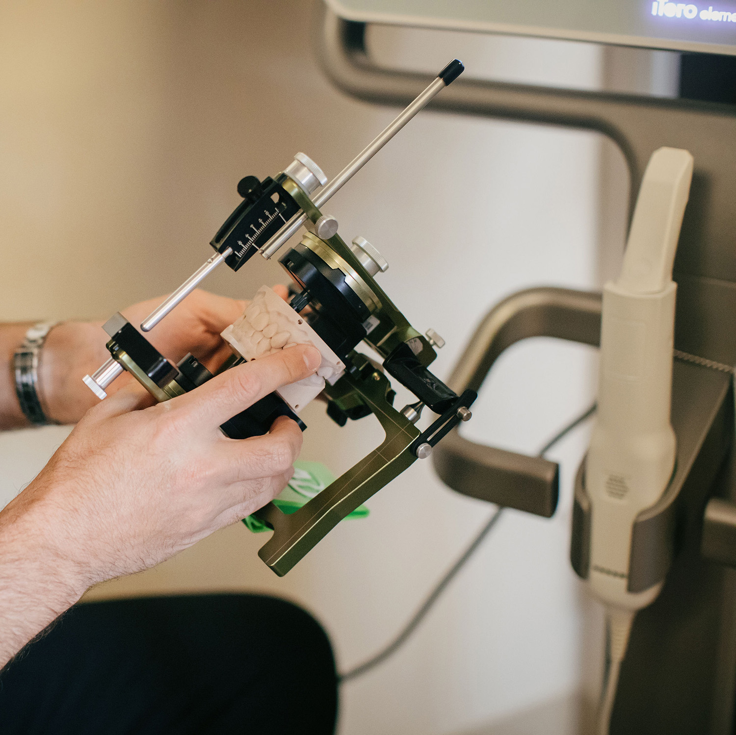 Dentist working with a precision articulator